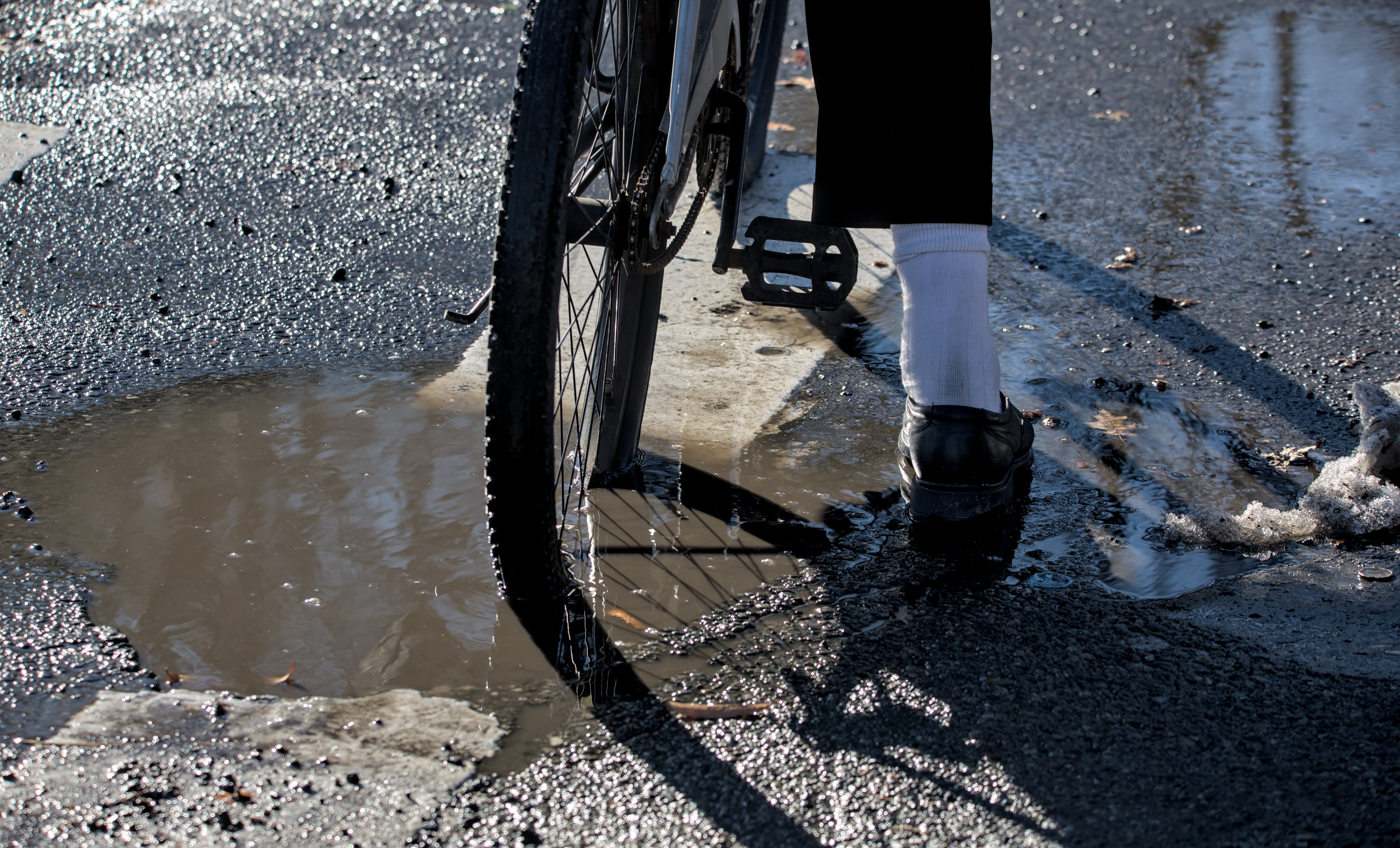 Puddle-Covered Potholes & Road Defects: Injuries to Cyclists and Motorcyclists After Storms